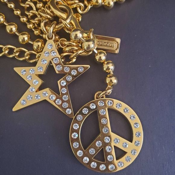 Coach Accessories - Coach Goldtone Chain Belt with Star and Peace Sign Accents 32 inches Long